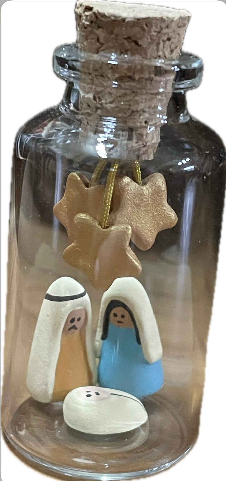Presepe in bottiglia verticale con stelle