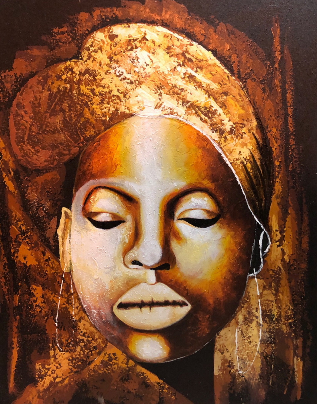 Quadro con volto di una donna africana